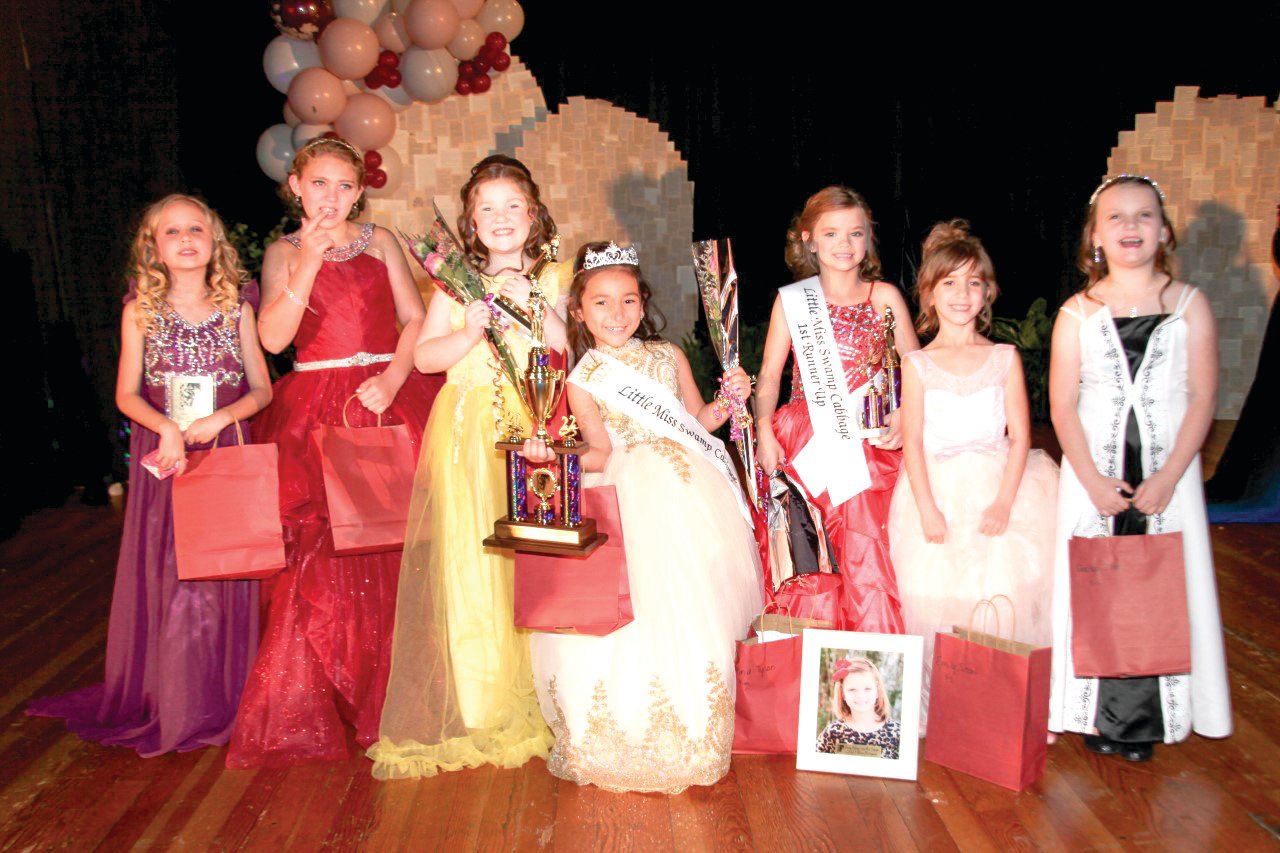 In the Swamp Cabbage Little Miss contest, left to right are: Makayela Hudson, Aubree Penuel, Second Runner-Up Aubrey Howard,  2022 Little Miss Swamp Cabbage Sophia Yzaguirre, First Runner-Up and Most Talented Reina Tyson, Emily Short and Shelby Zilen [Photo by Jerri Blake]